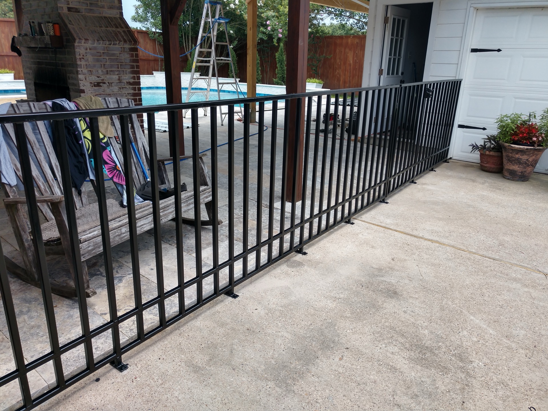 Modern black pool fence