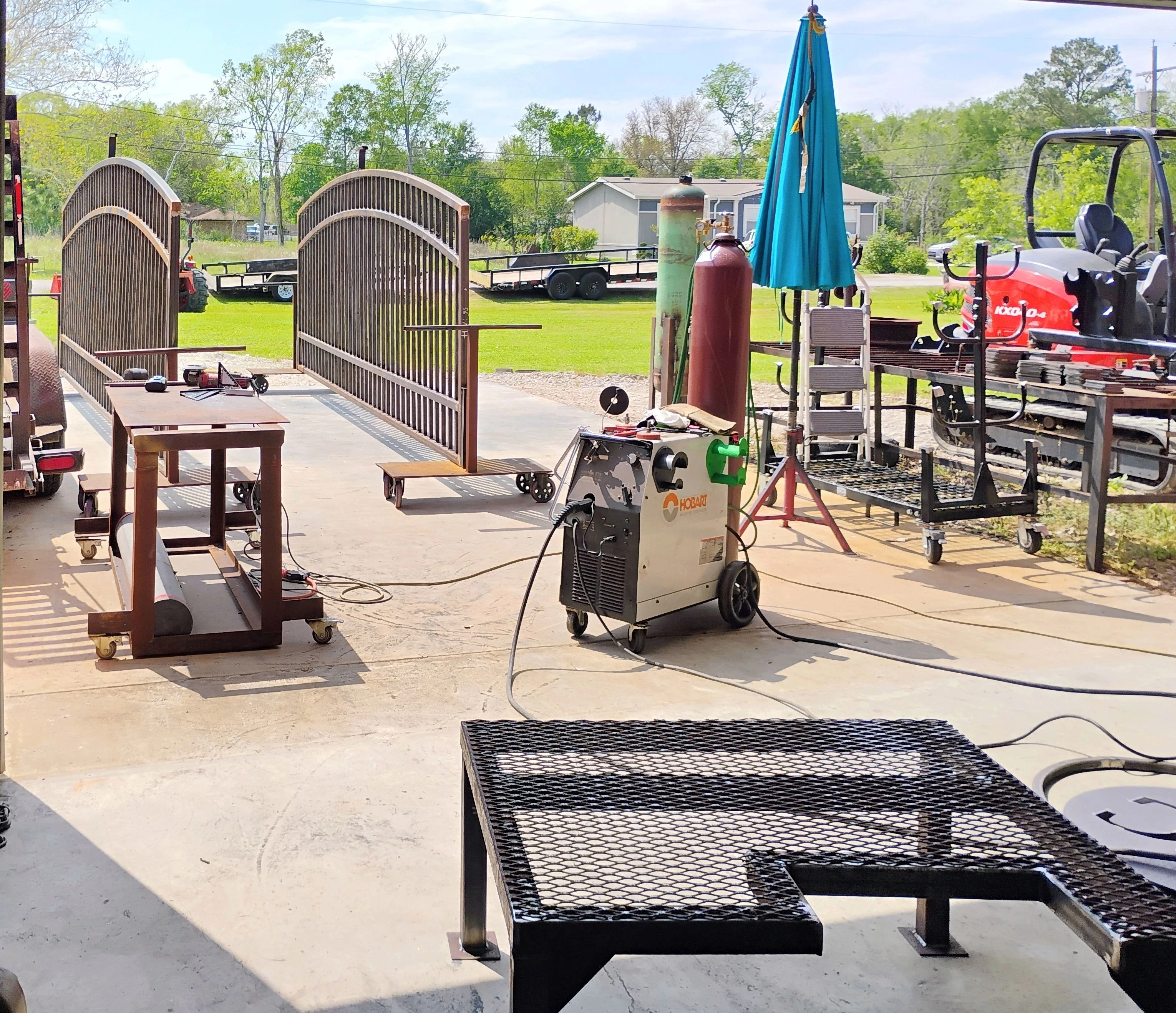 Custom arched metal driveway gate