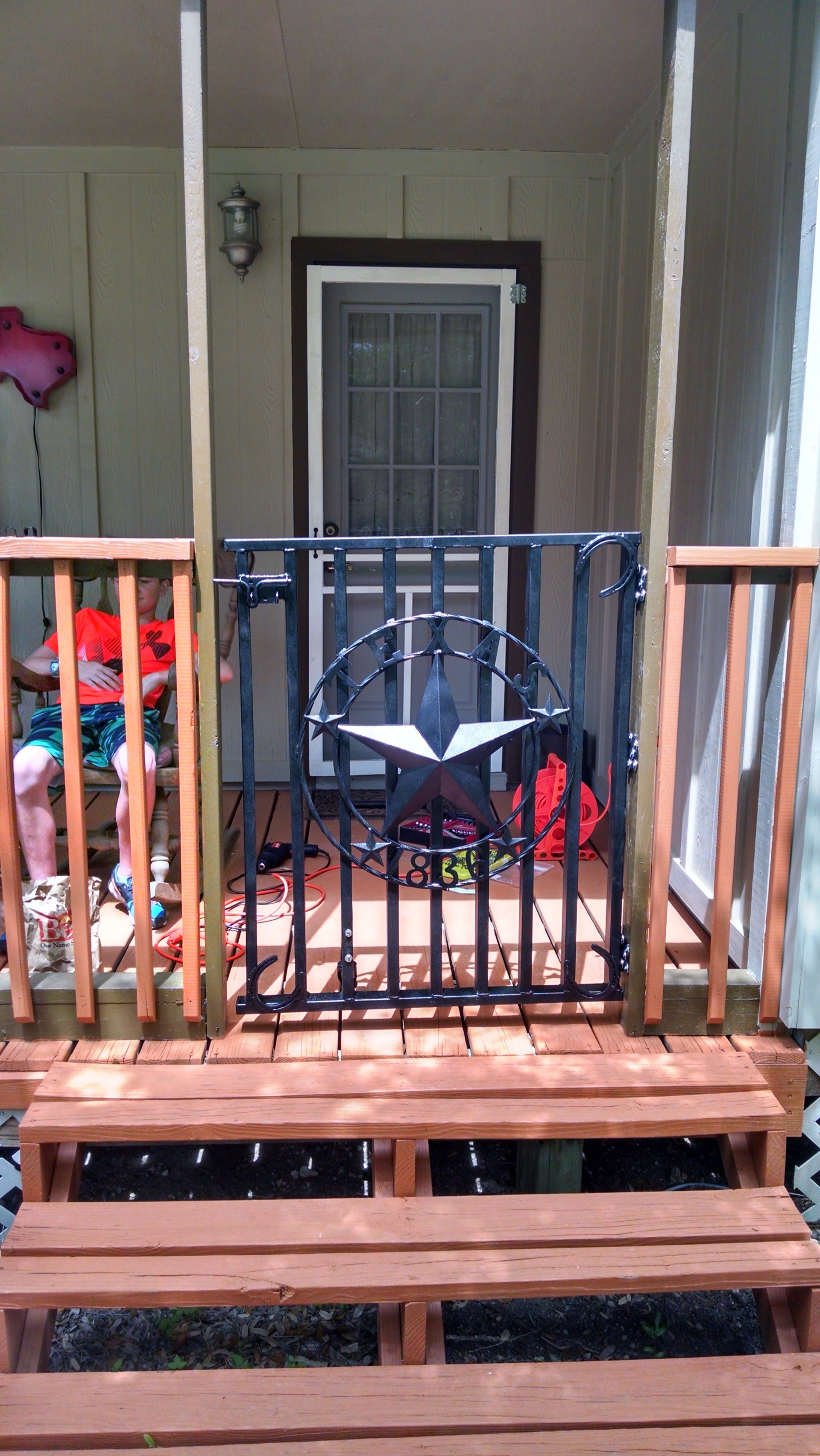 Porch gate with Texas star design